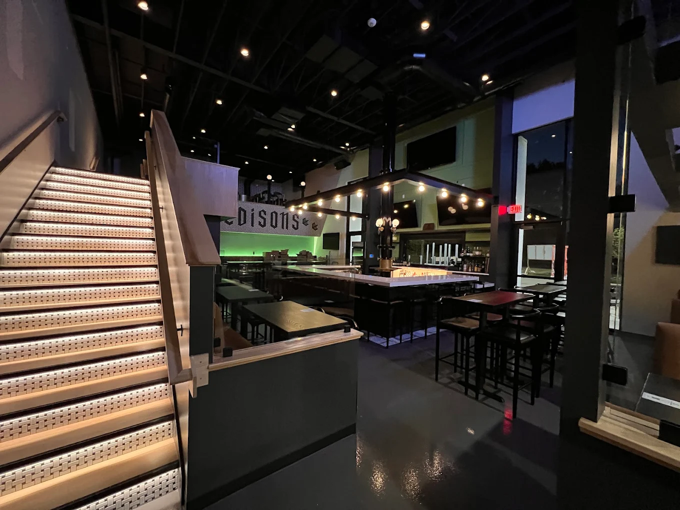 Interior of Edison's Gastropub bar with edison bulbs